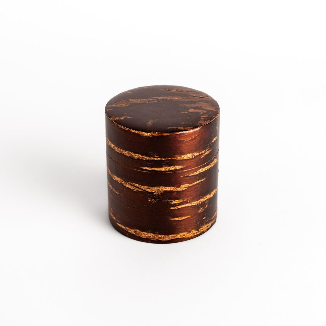 Cherry bark tea caddy and scoop set, showcasing the natural beauty of the bark and perfect for storing and serving your favorite loose leaf tea.