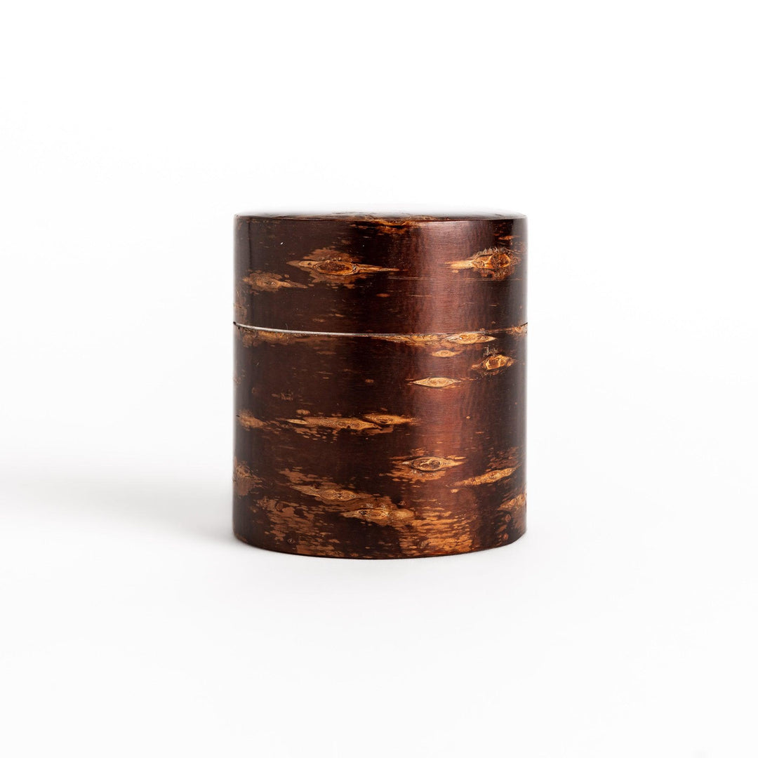 Classic cherry bark tea canister with a rich, dark brown finish and a natural wood grain, ideal for storing and preserving loose leaf tea.