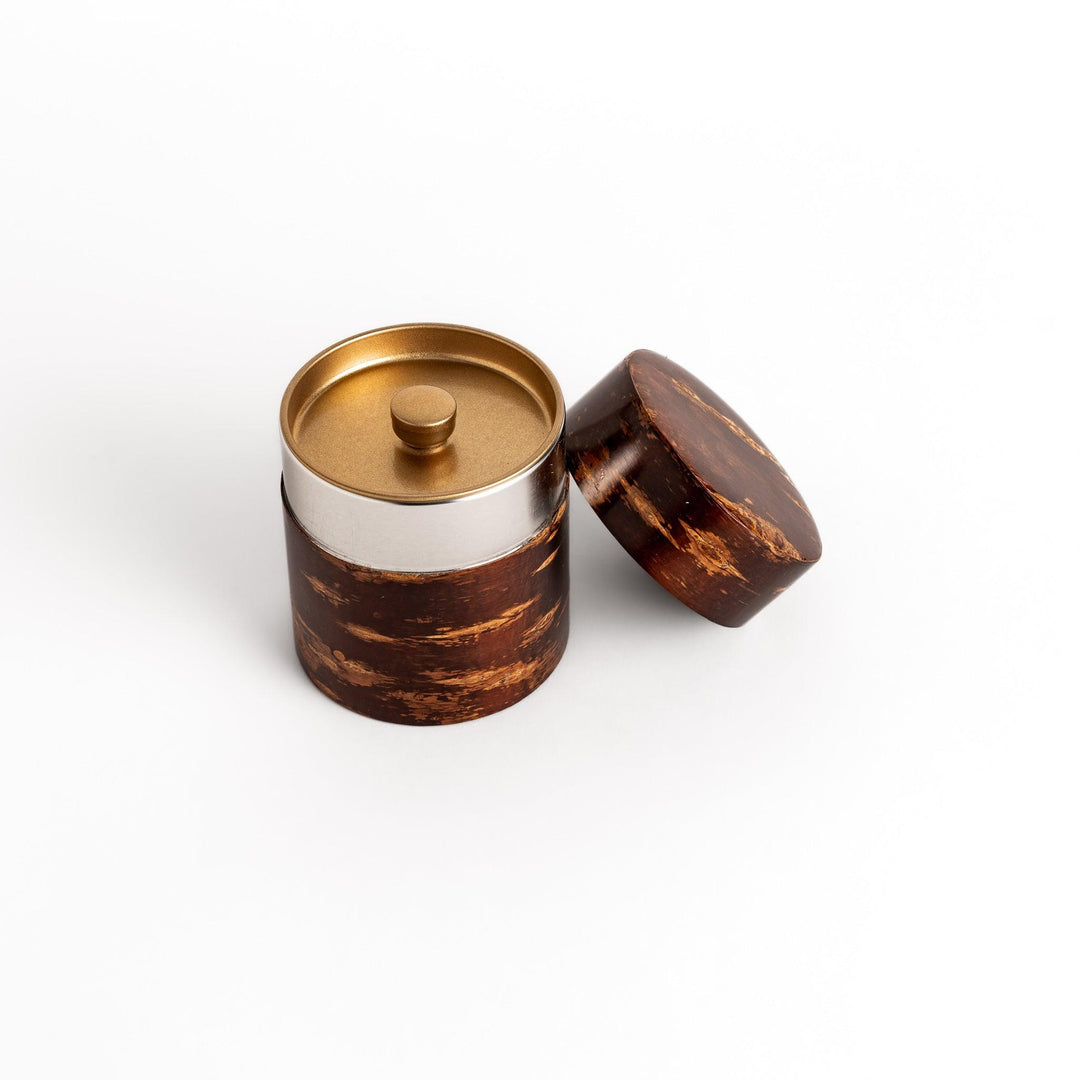Classic cherry bark tea canister with a rich, dark brown finish and a natural wood grain, ideal for storing and preserving loose leaf tea.