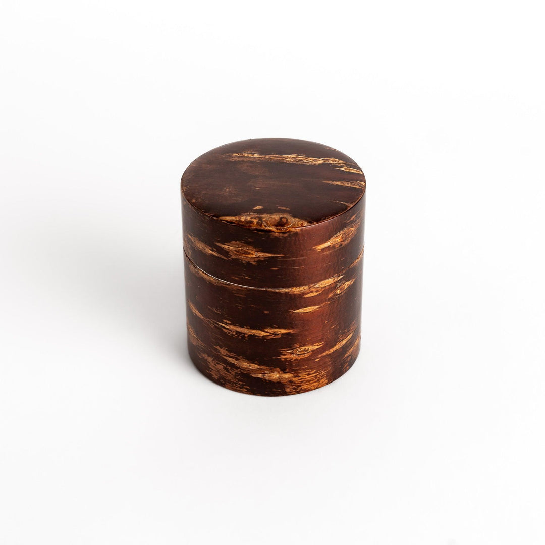 Classic cherry bark tea canister with a rich, dark brown finish and a natural wood grain, ideal for storing and preserving loose leaf tea.