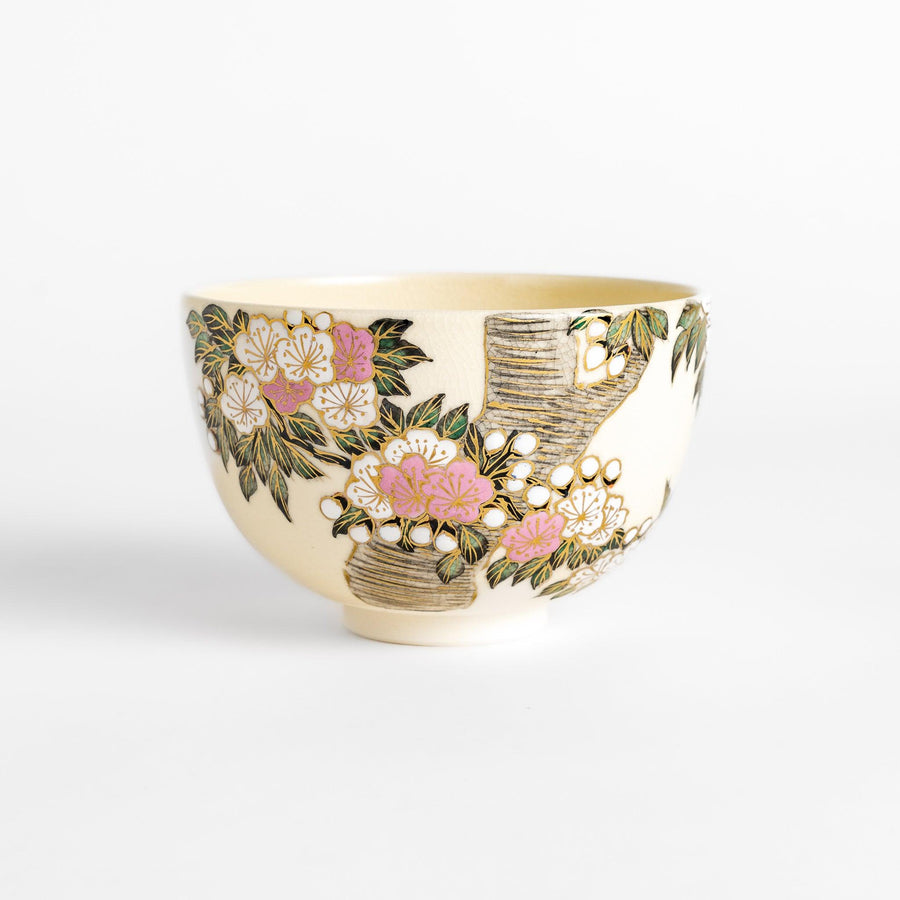 Beautiful Matcha Bowl adorned with delicate cherry blossom and tree motifs, accented with gold detailing for an elegant tea experience.