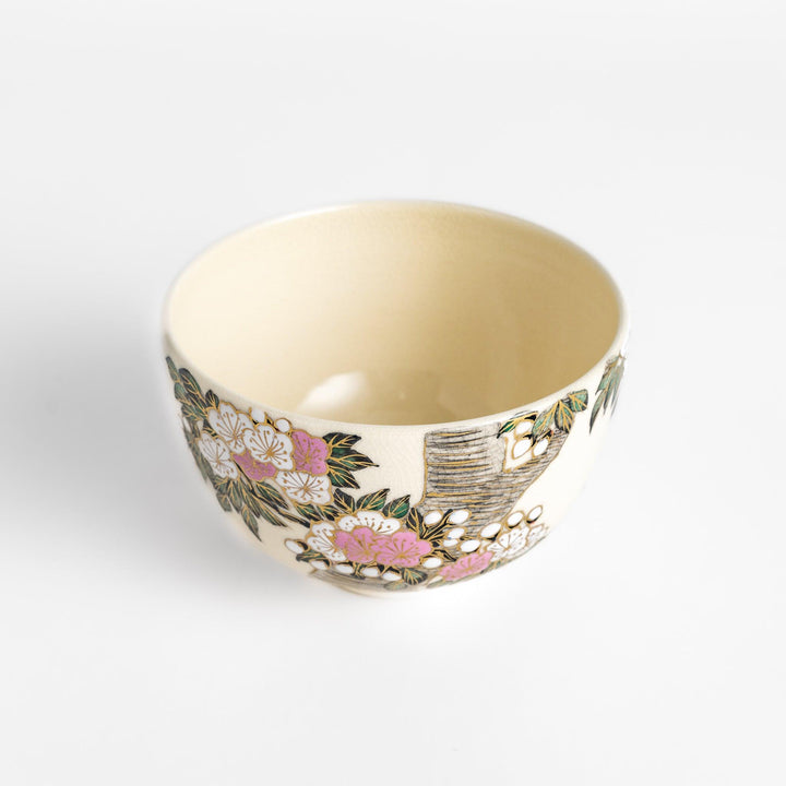Beautiful Matcha Bowl adorned with delicate cherry blossom and tree motifs, accented with gold detailing for an elegant tea experience.