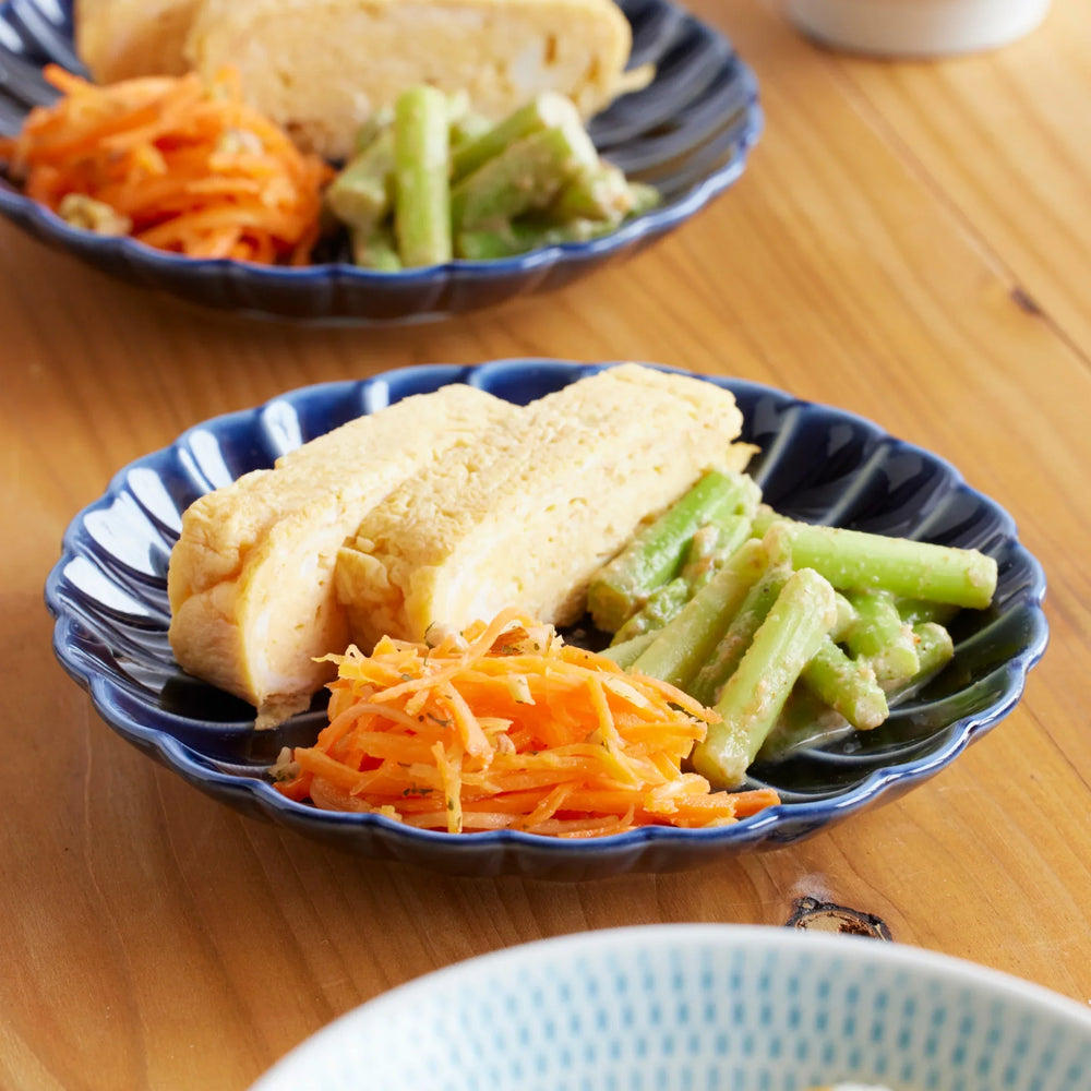 Japanese blue chrysanthemum small plate with tamagoyaki, carrots, and green beans, showcasing elegant handmade tableware for everyday meals.