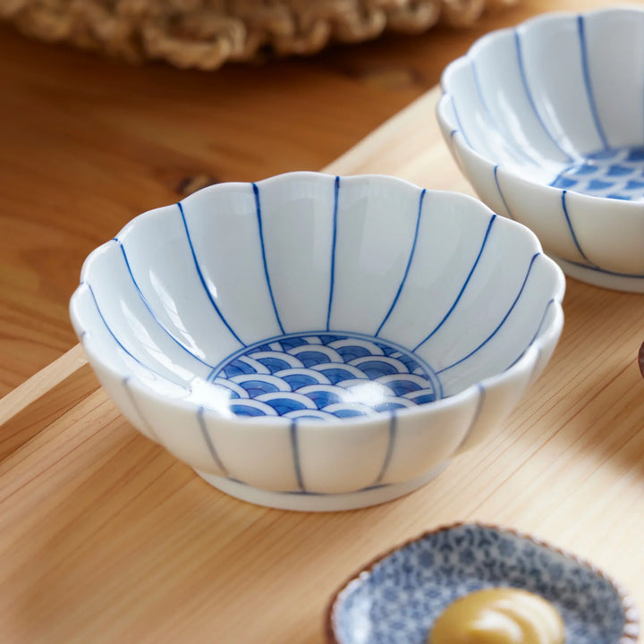 Chrysanthemum Wave Dessert Bowl with scalloped rim and traditional blue wave motif, perfect Japanese porcelain for sweets or sides.