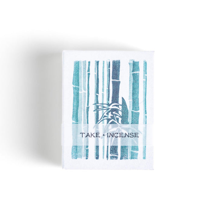 Incense featuring deep green sticks in a box adorned with a traditional Japanese bamboo design, offering a fresh and calming fragrance inspired by nature.