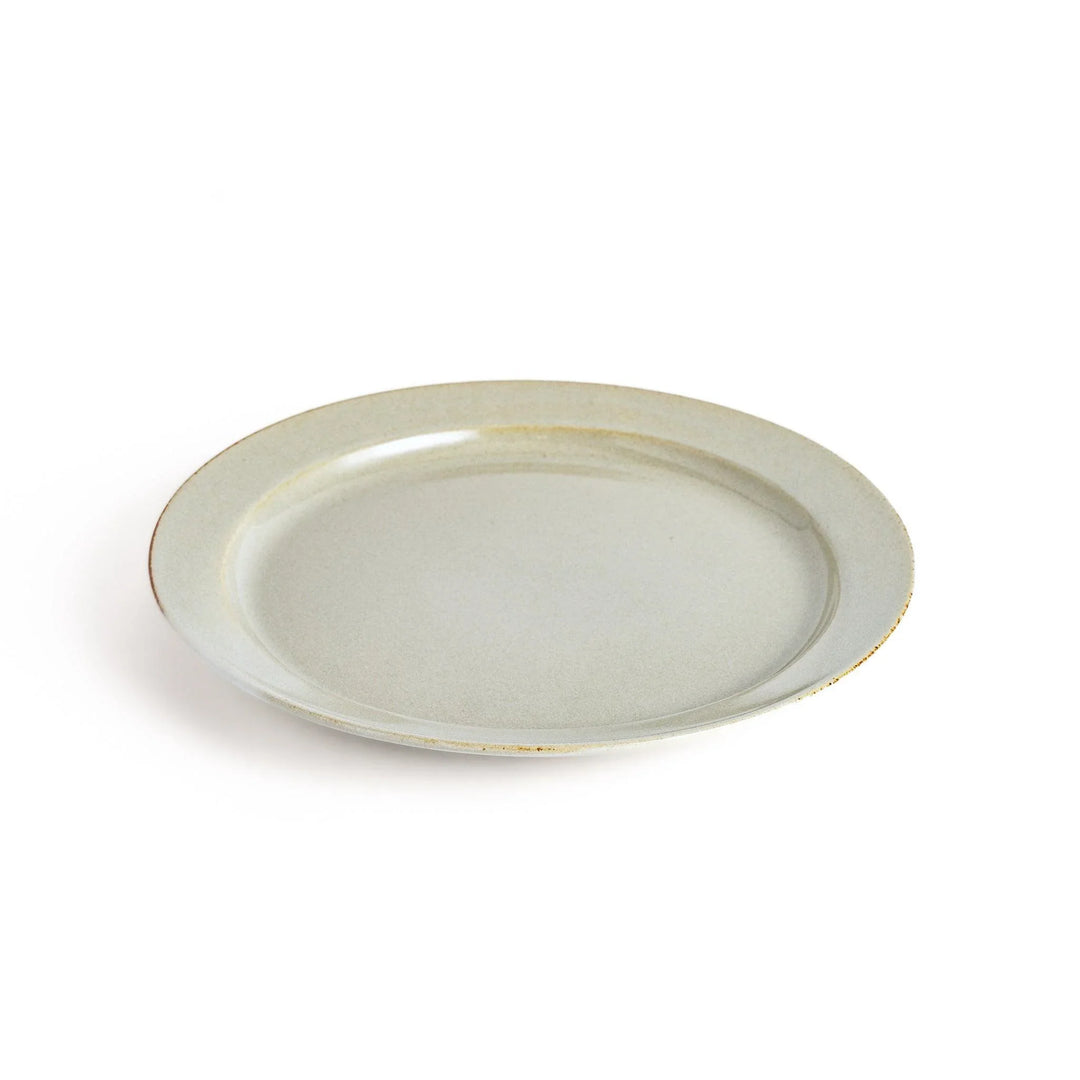 White ceramic dinner plate with a glossy finish, offering a clean and timeless design perfect for various table settings.