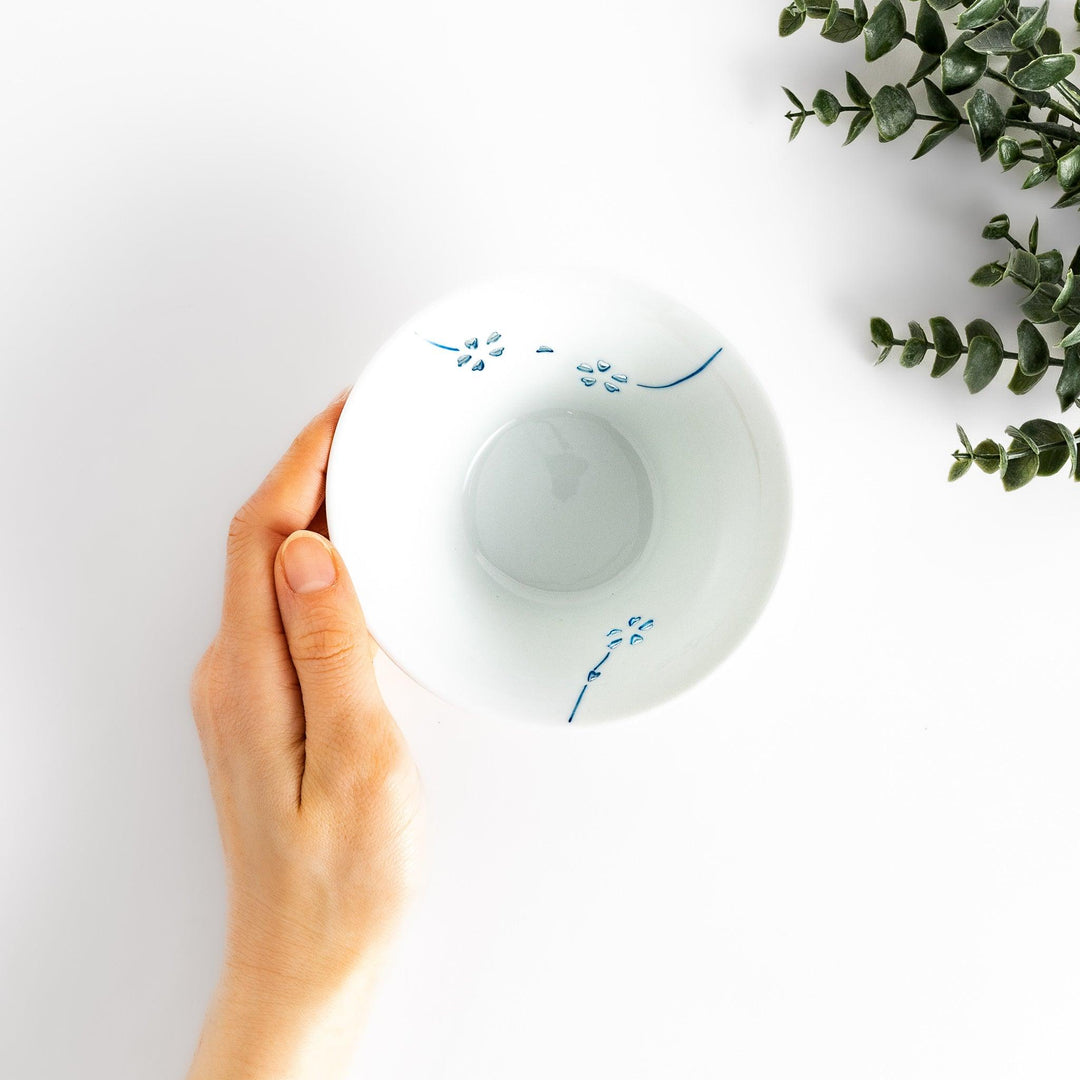 Colorful Petal Crystal Rice Bowl featuring intricate blue flower petal designs on soft white porcelain, perfect for serving rice with elegance and style.
