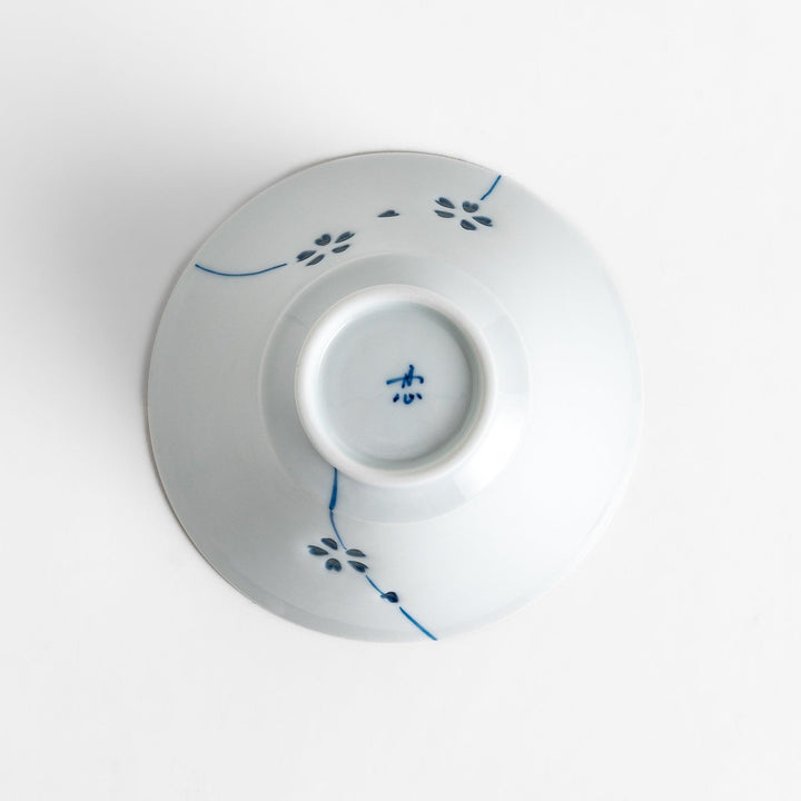 Colorful Petal Crystal Rice Bowl featuring intricate blue flower petal designs on soft white porcelain, perfect for serving rice with elegance and style.
