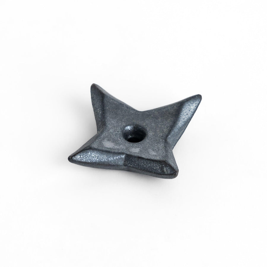 Unique ninja star-shaped chopstick rest with a sleek metallic finish, adding a playful and stylish touch to your dining experience.