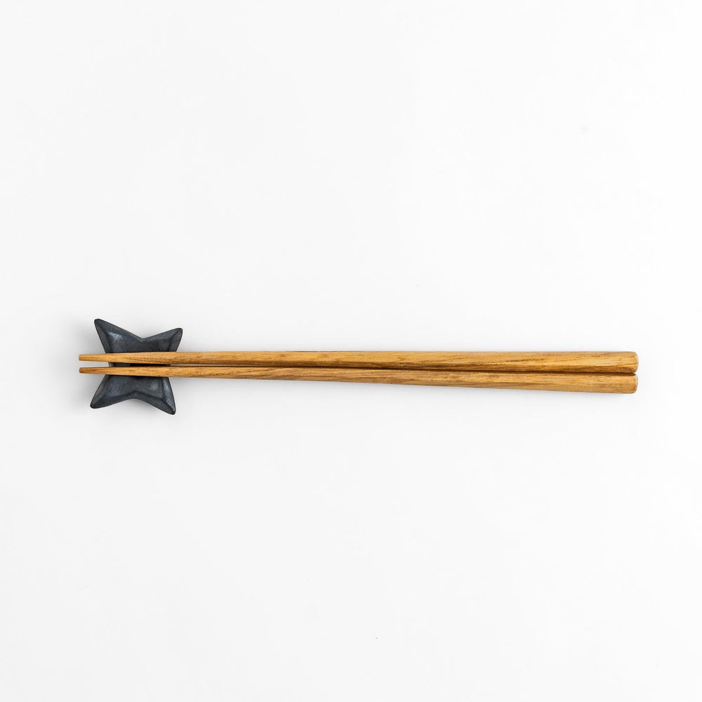 Unique ninja star-shaped chopstick rest with a sleek metallic finish, adding a playful and stylish touch to your dining experience.
