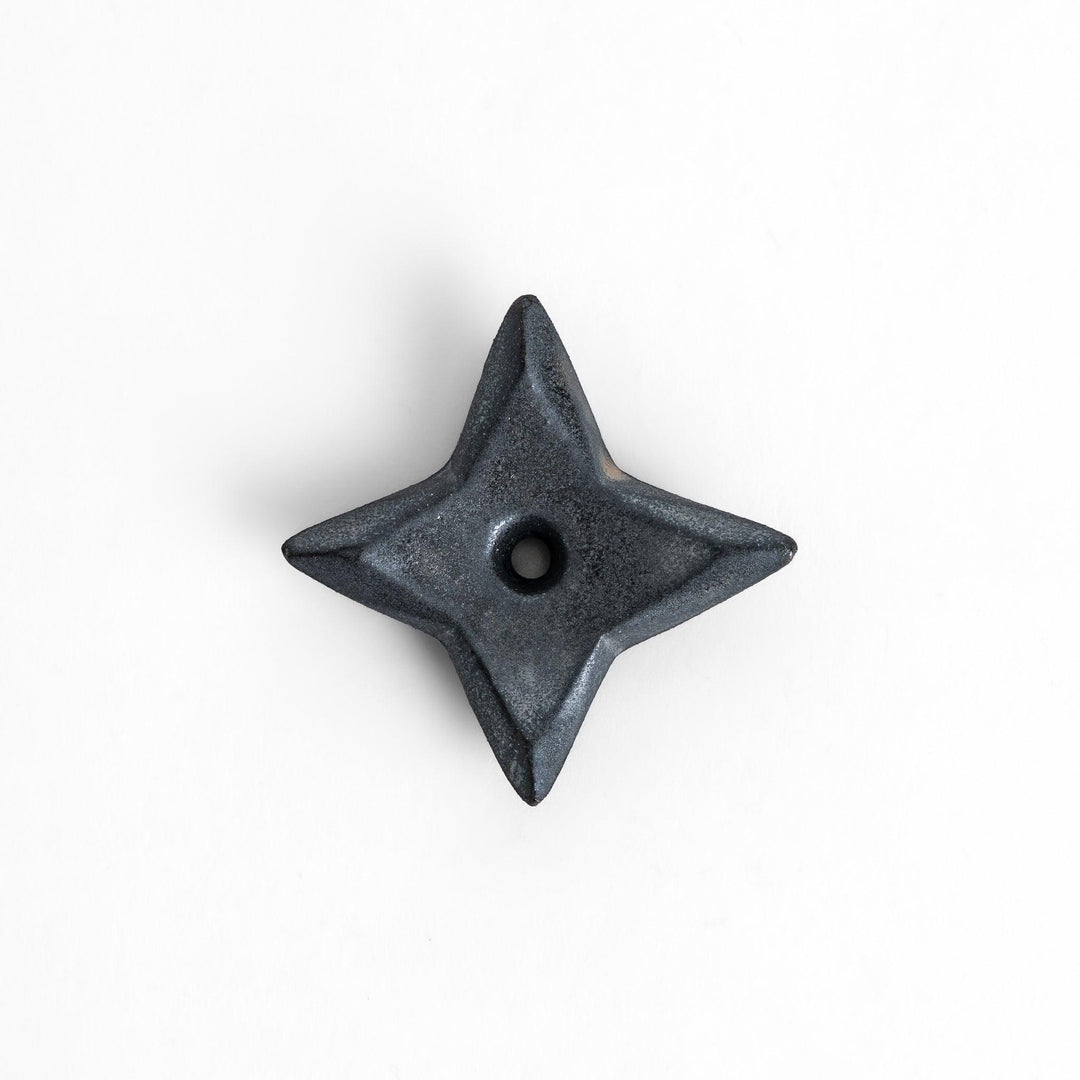 Unique ninja star-shaped chopstick rest with a sleek metallic finish, adding a playful and stylish touch to your dining experience.