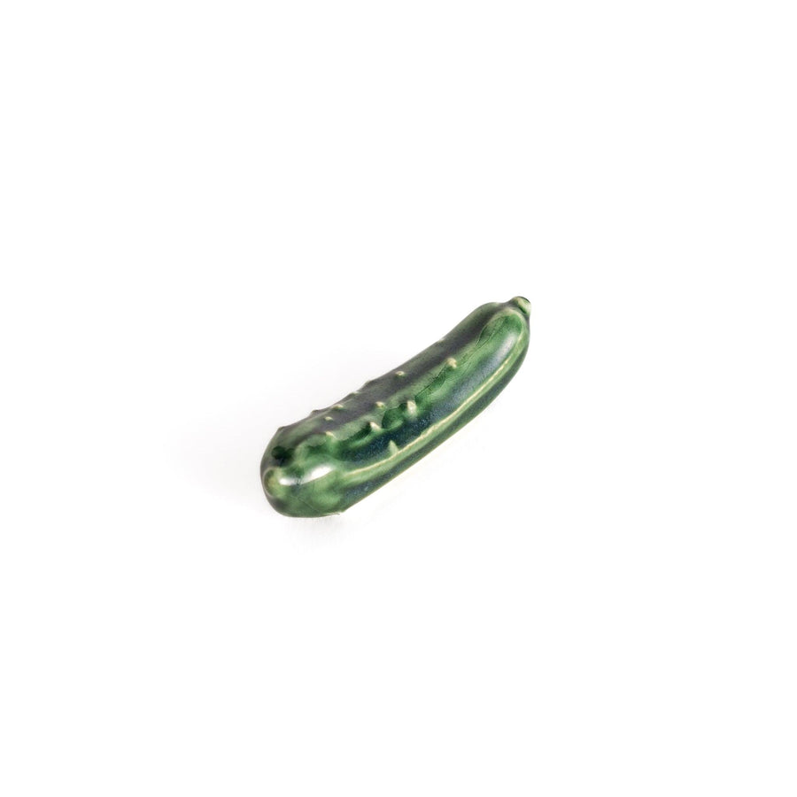 Glossy green ceramic cucumber chopstick rest with textured detailing, designed to add a playful and unique touch to your table setting.