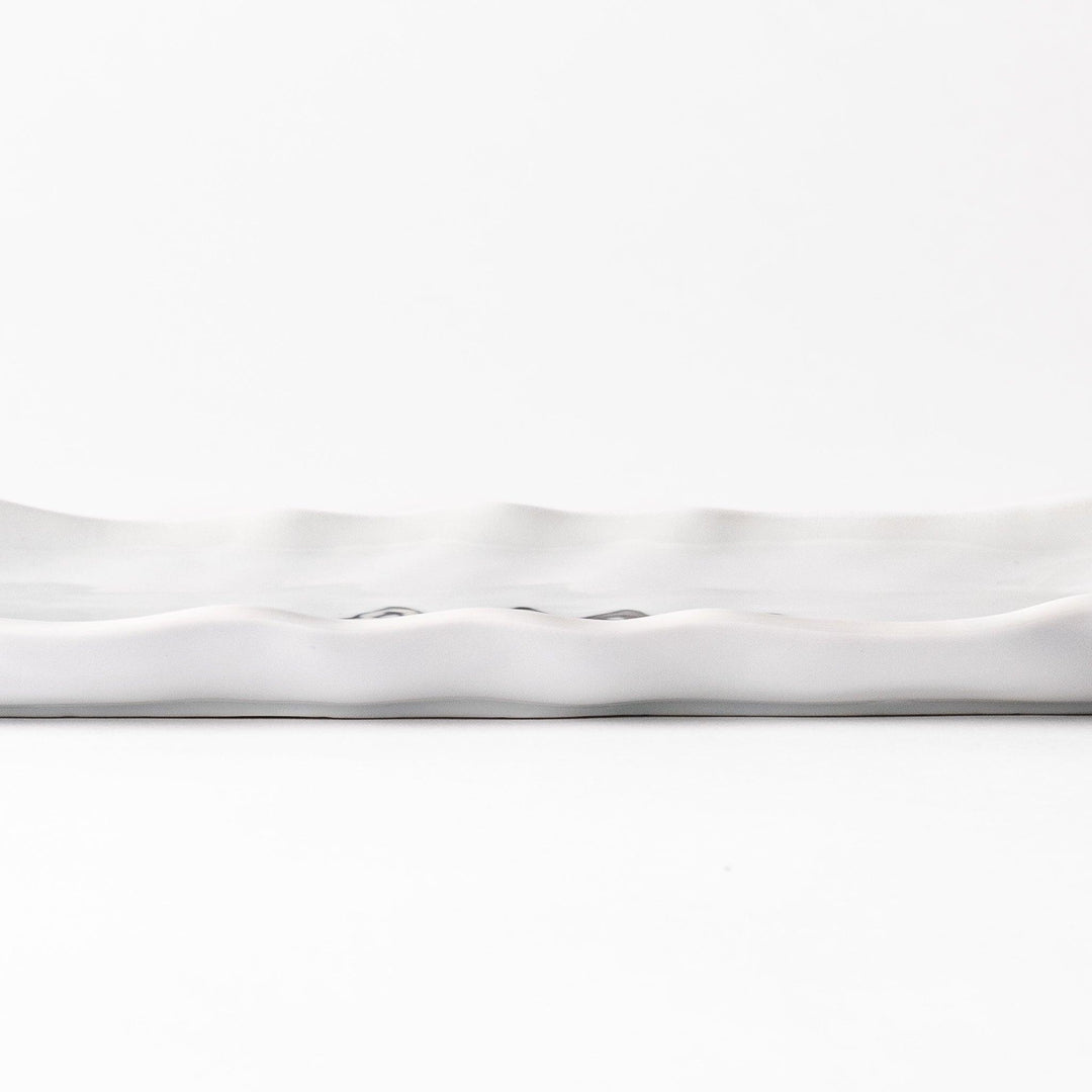 Playful salad plate featuring a row of curious cats in black, white, orange, and blue, with a wavy edge, adding a fun and whimsical touch to your table.