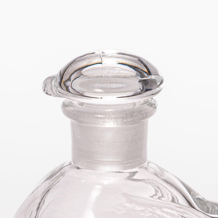 Clear glass Ethereal Songbird soy sauce dispenser with a delicate bird design, perfect for adding elegance and charm to your table setting.