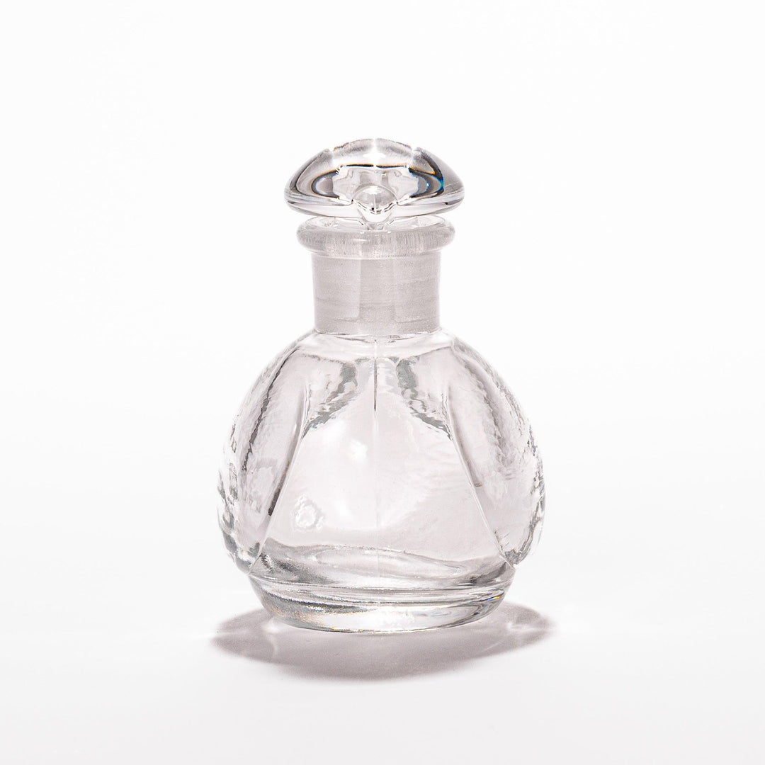Clear glass Ethereal Songbird soy sauce dispenser with a delicate bird design, perfect for adding elegance and charm to your table setting.