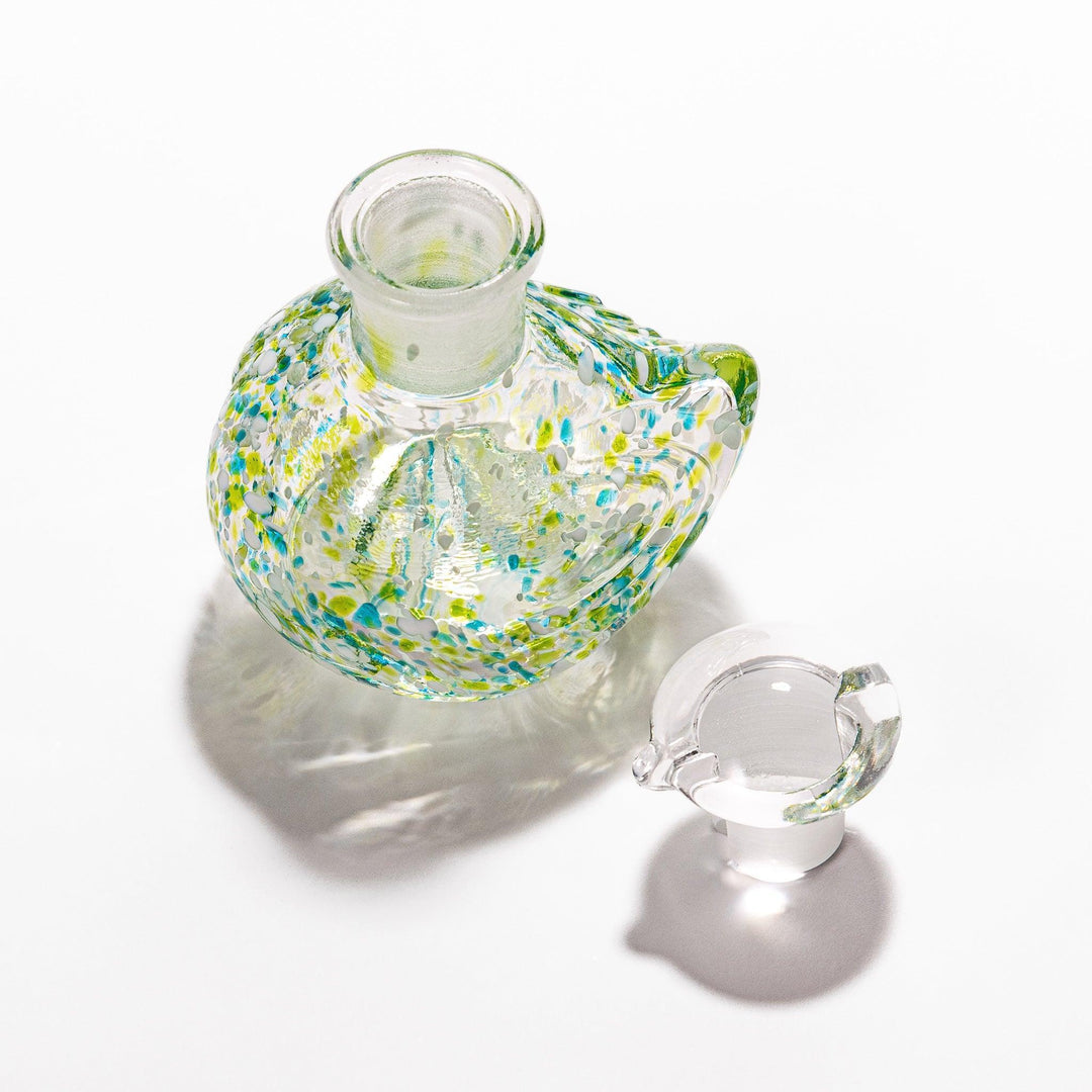 Colorful green and blue speckled Ethereal Songbird soy sauce dispenser with a delicate bird design, adding charm and elegance to your table.