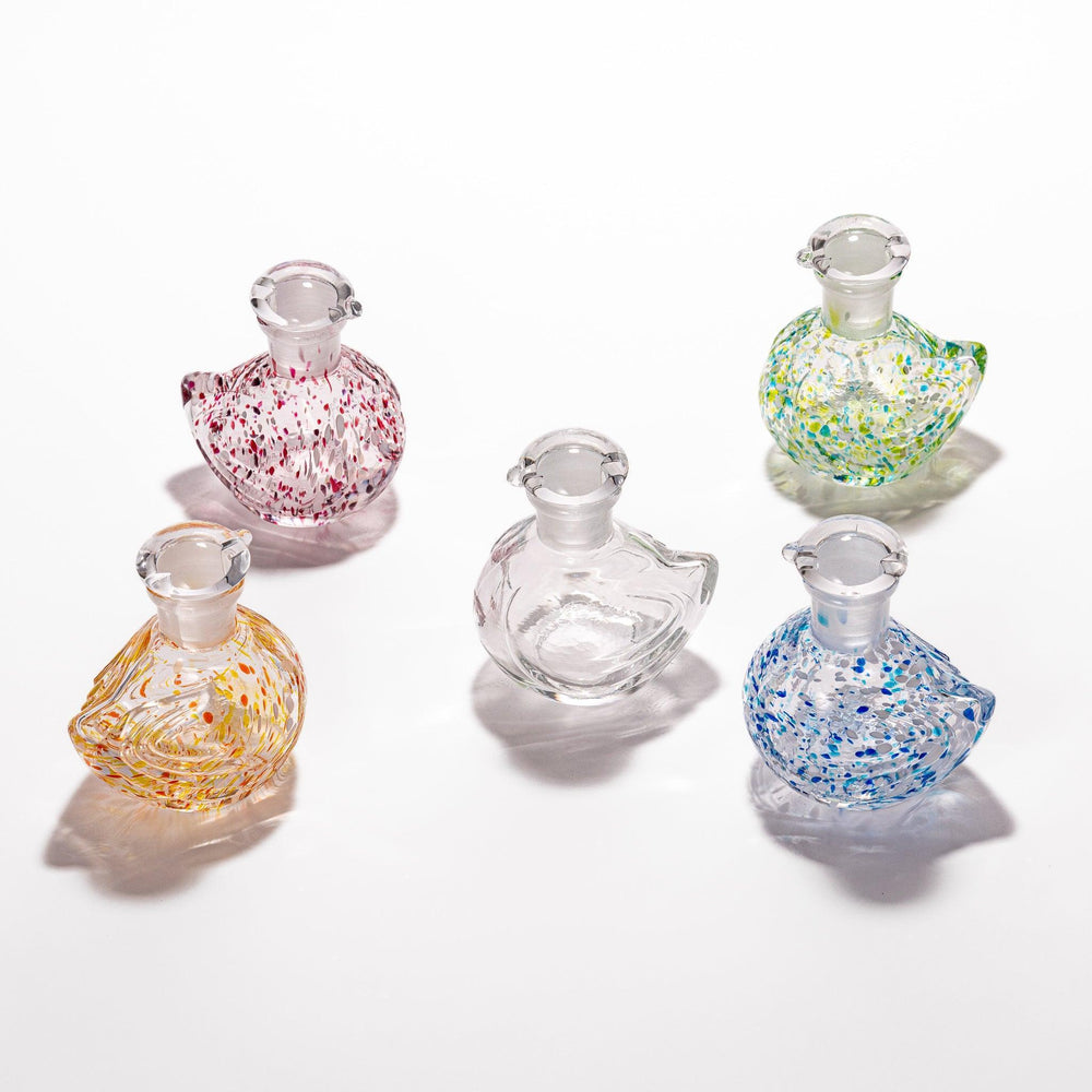 Charming Ethereal Songbird soy sauce dispenser set with colorful speckled designs, perfect for adding a whimsical touch to your dining table.