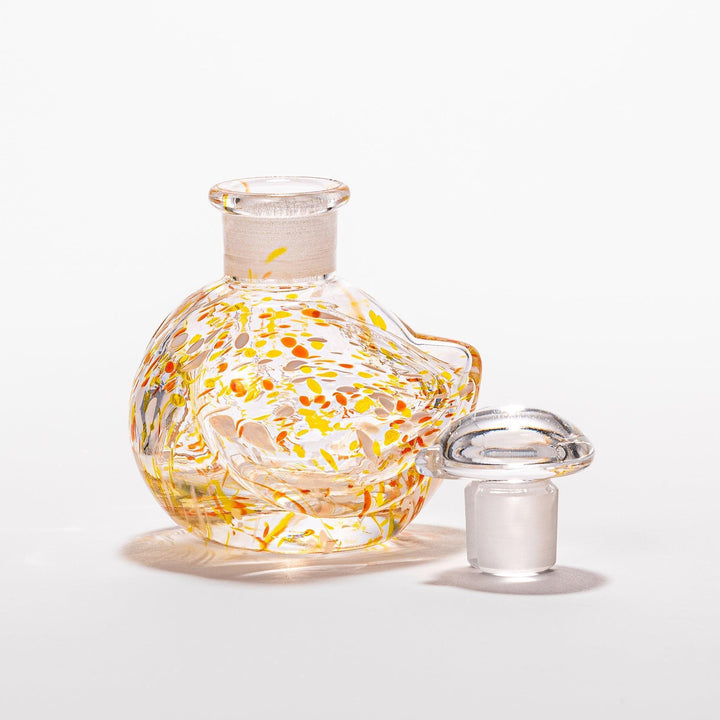 Vibrant orange and yellow speckled Ethereal Songbird soy sauce dispenser with a charming bird design, perfect for adding a playful touch to your table.