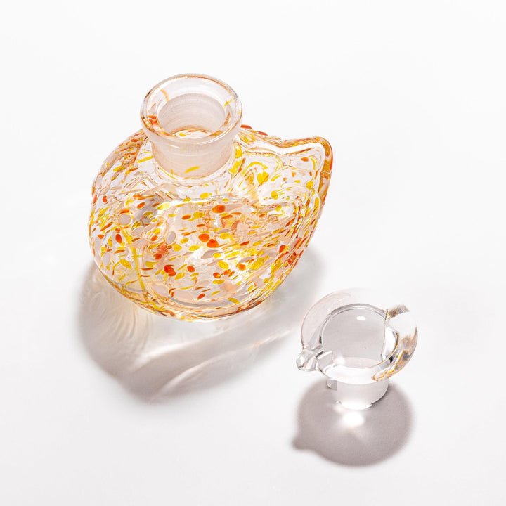 Vibrant orange and yellow speckled Ethereal Songbird soy sauce dispenser with a charming bird design, perfect for adding a playful touch to your table.