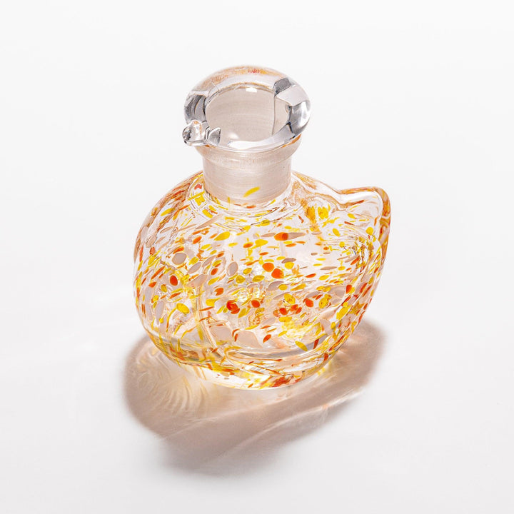 Vibrant orange and yellow speckled Ethereal Songbird soy sauce dispenser with a charming bird design, perfect for adding a playful touch to your table.