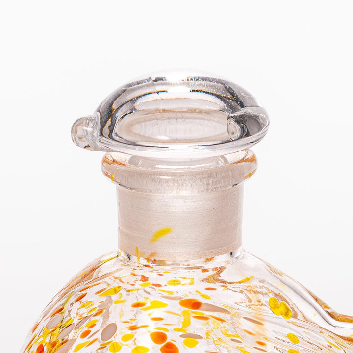 Vibrant orange and yellow speckled Ethereal Songbird soy sauce dispenser with a charming bird design, perfect for adding a playful touch to your table.
