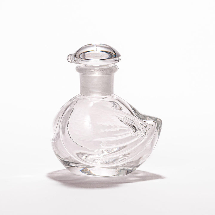 Clear glass Ethereal Songbird soy sauce dispenser with a delicate bird design, perfect for adding elegance and charm to your table setting.