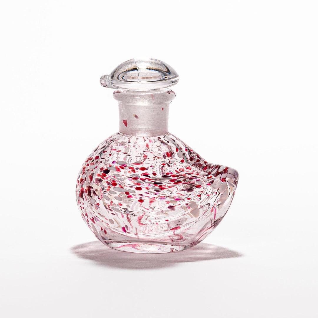 Red and white speckled Ethereal Songbird soy sauce dispenser with a delicate bird design, adding a vibrant touch to your dining experience.