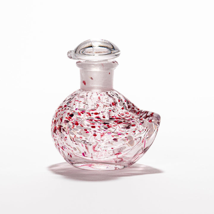 Red and white speckled Ethereal Songbird soy sauce dispenser with a delicate bird design, adding a vibrant touch to your dining experience.