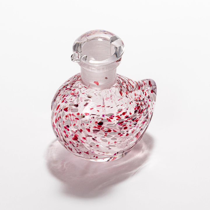 Red and white speckled Ethereal Songbird soy sauce dispenser with a delicate bird design, adding a vibrant touch to your dining experience.