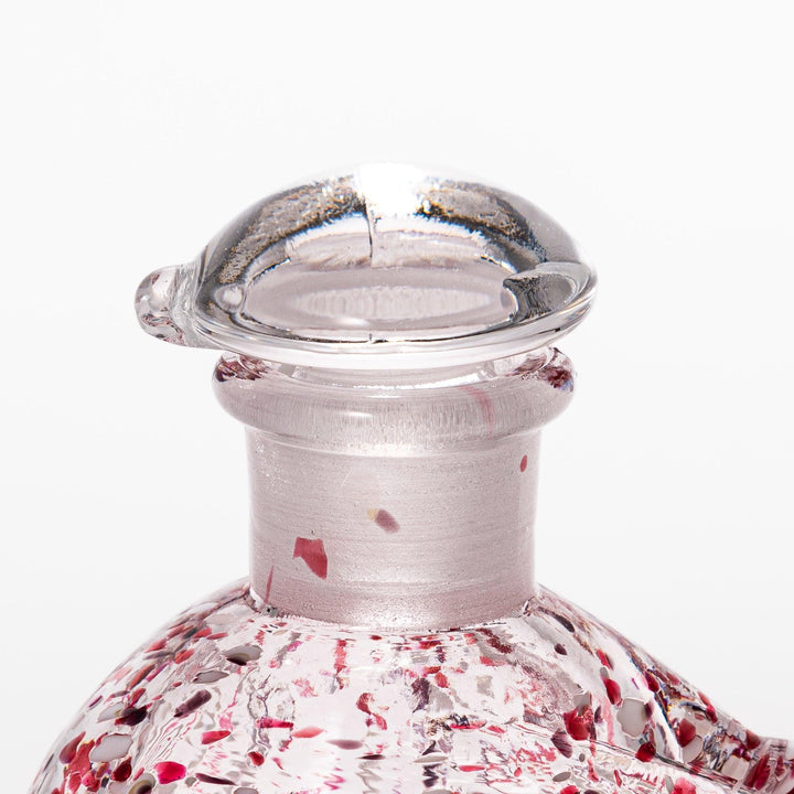 Red and white speckled Ethereal Songbird soy sauce dispenser with a delicate bird design, adding a vibrant touch to your dining experience.
