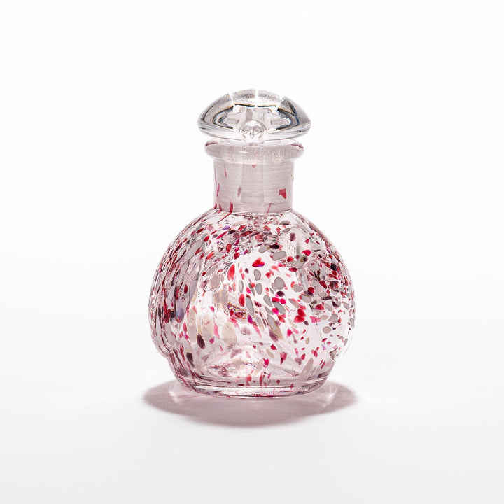 Red and white speckled Ethereal Songbird soy sauce dispenser with a delicate bird design, adding a vibrant touch to your dining experience.