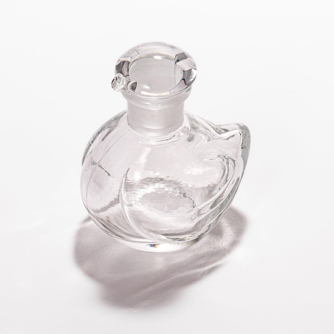 Clear glass Ethereal Songbird soy sauce dispenser with a delicate bird design, perfect for adding elegance and charm to your table setting.