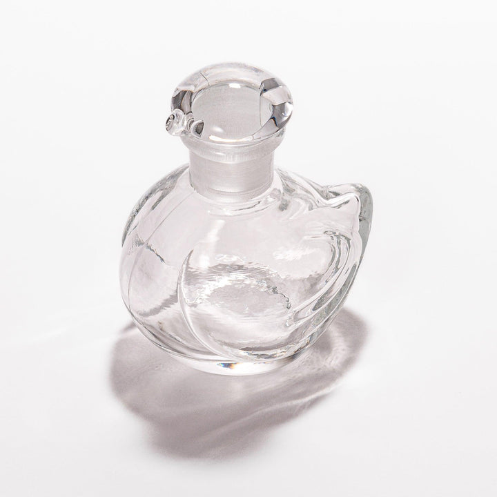 Clear glass Ethereal Songbird soy sauce dispenser with a delicate bird design, perfect for adding elegance and charm to your table setting.