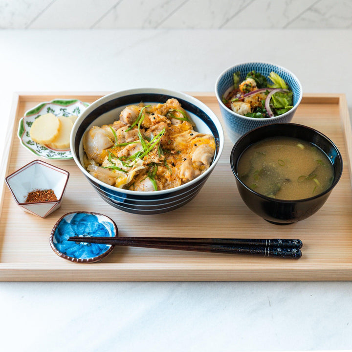 Ceramic condiment bowls, each with a delicate gradient pattern. The bowls are in various pastel colors, including red, green, turkish blue, purple, and blue showcasing their textured design.