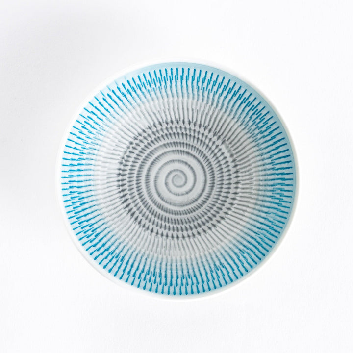 A light blue dessert plate with radiating spiral-striped patterns, viewed from the front.
