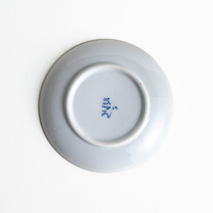 Round plate with green Mt. Fuji pattern and orange floral design.