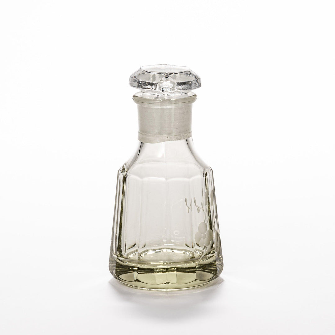 Elegant soy sauce dispenser with a frosted plum blossom design, featuring a smooth pour spout and an intricate geometric base. 