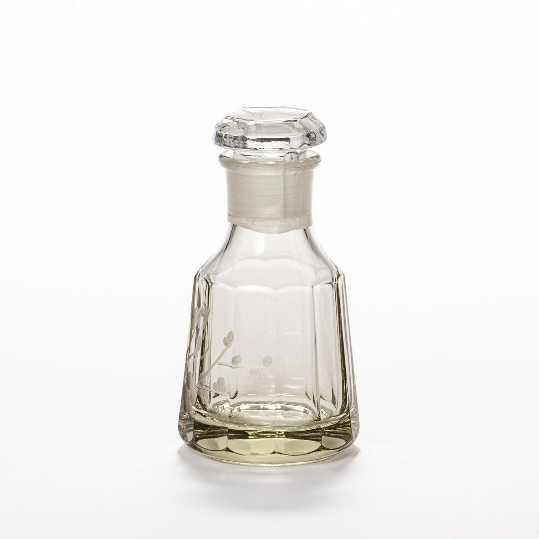 Elegant soy sauce dispenser with a frosted plum blossom design, featuring a smooth pour spout and an intricate geometric base. 