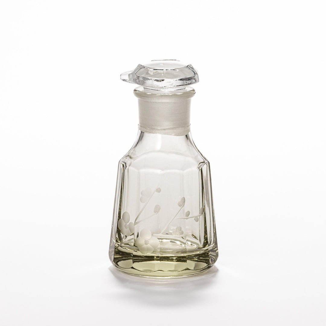 Elegant soy sauce dispenser with a frosted plum blossom design, featuring a smooth pour spout and an intricate geometric base. 