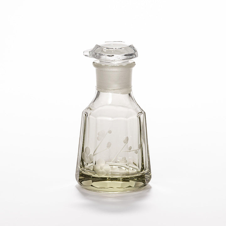 Elegant soy sauce dispenser with a frosted plum blossom design, featuring a smooth pour spout and an intricate geometric base. 