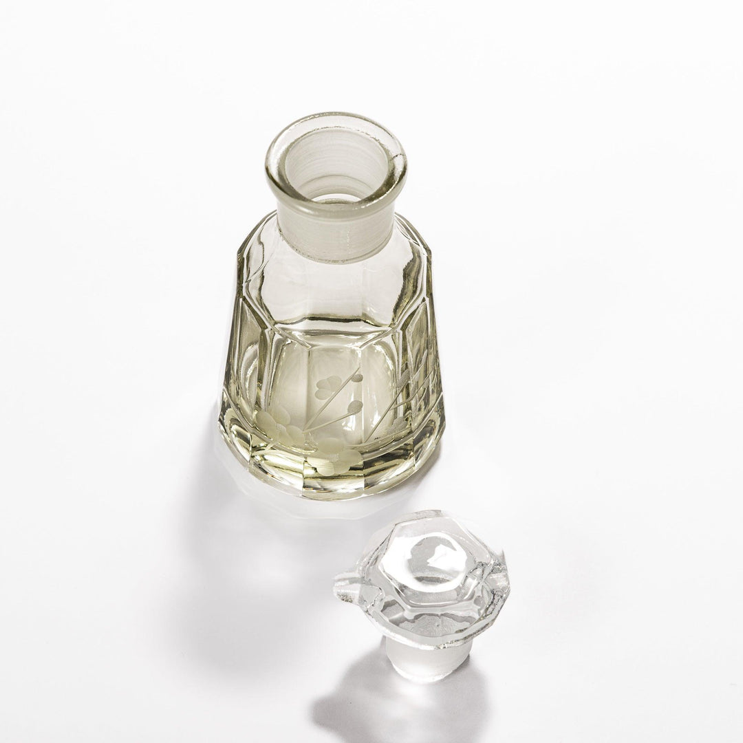 Elegant soy sauce dispenser with a frosted plum blossom design, featuring a smooth pour spout and an intricate geometric base. 
