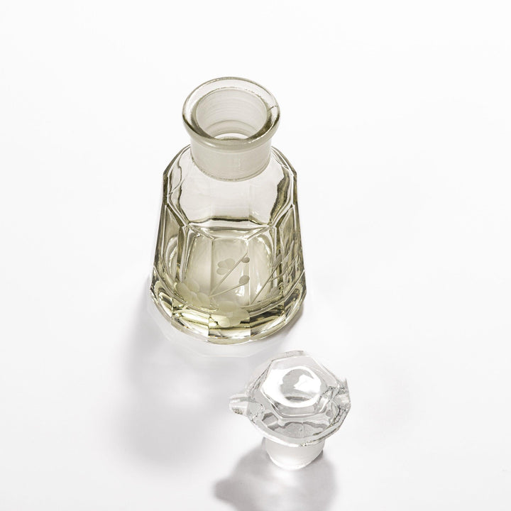 Elegant soy sauce dispenser with a frosted plum blossom design, featuring a smooth pour spout and an intricate geometric base. 