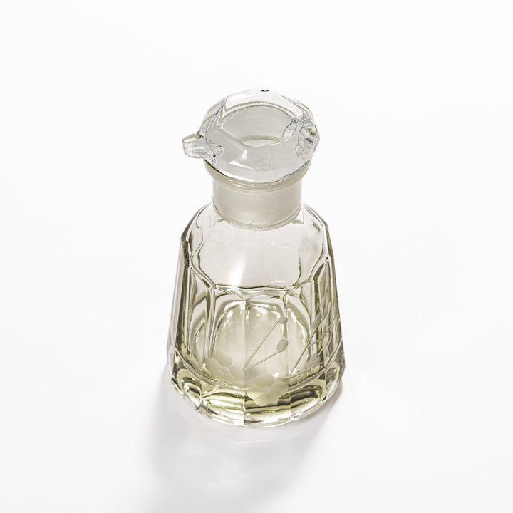 Elegant soy sauce dispenser with a frosted plum blossom design, featuring a smooth pour spout and an intricate geometric base. 