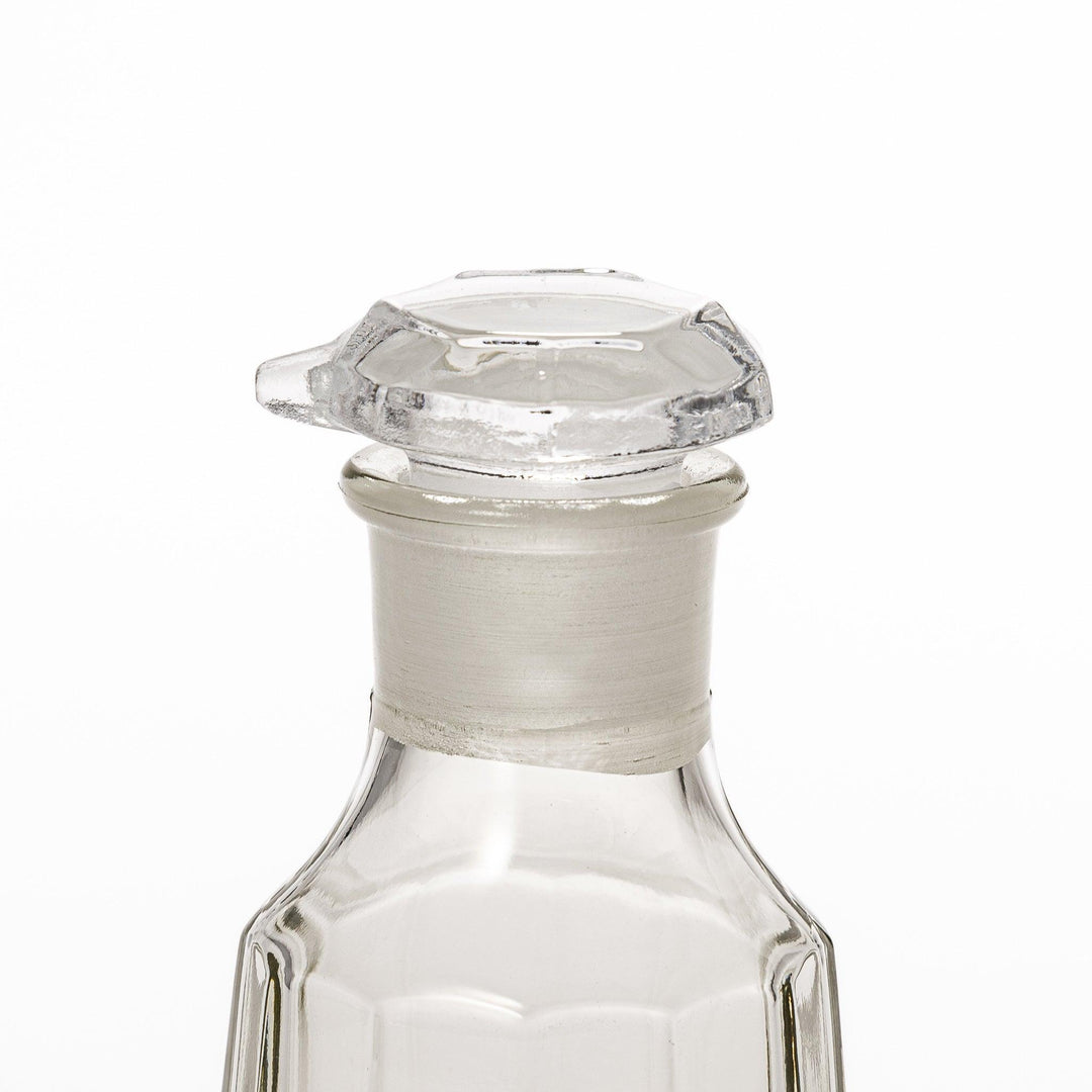 Elegant soy sauce dispenser with a frosted plum blossom design, featuring a smooth pour spout and an intricate geometric base. 