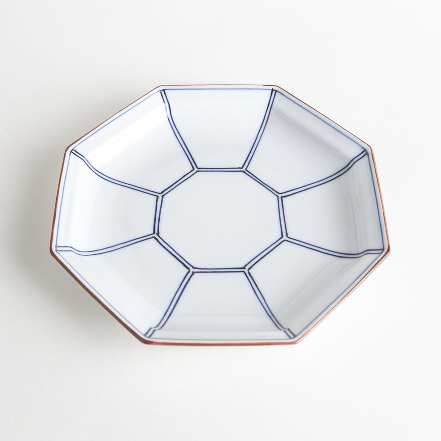 An octagonal porcelain salad plate with a minimalist grid pattern.