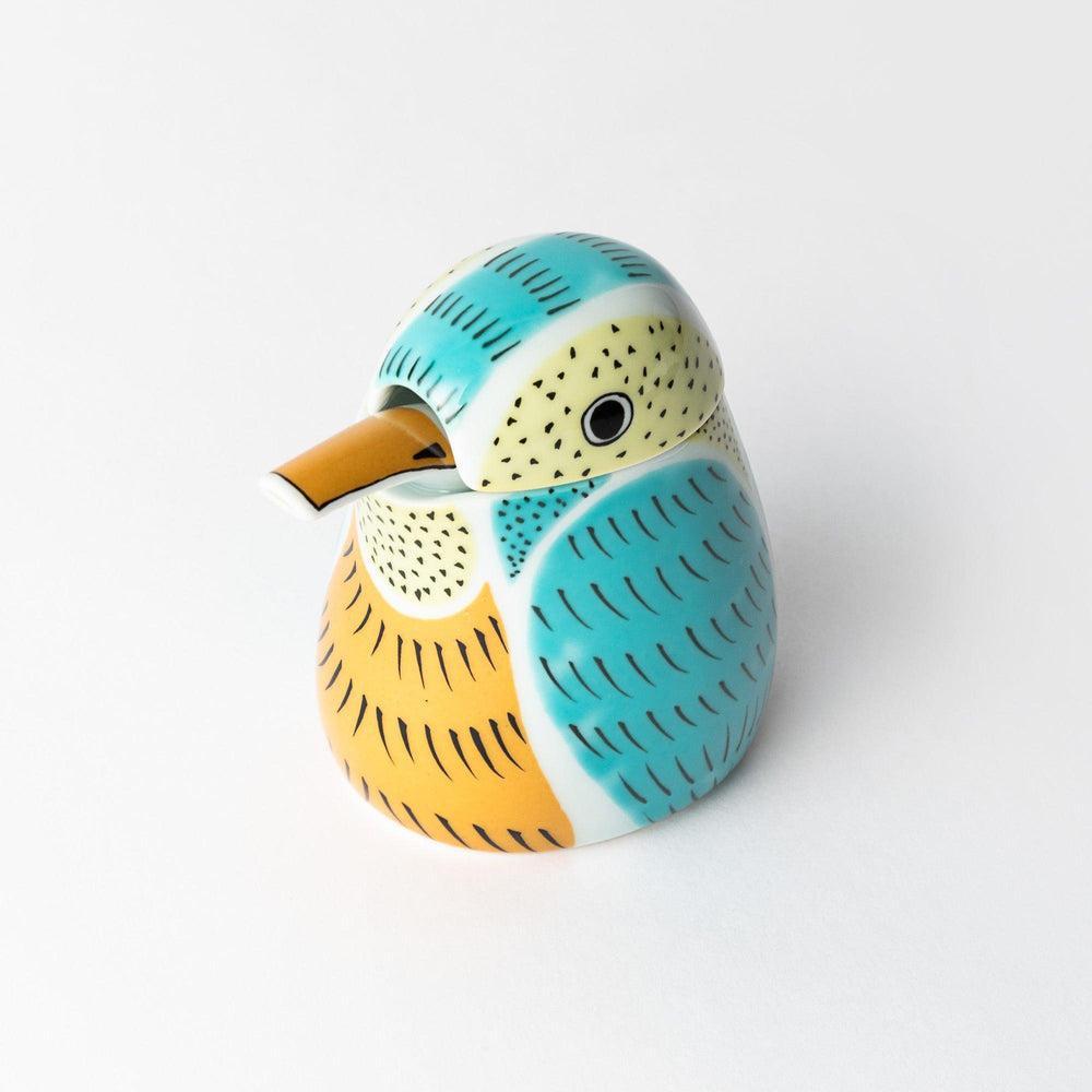A bird-shaped kingfisher ceramic soy sauce dispenser from Japan with vibrant patterns in turquoise, yellow, and green.
