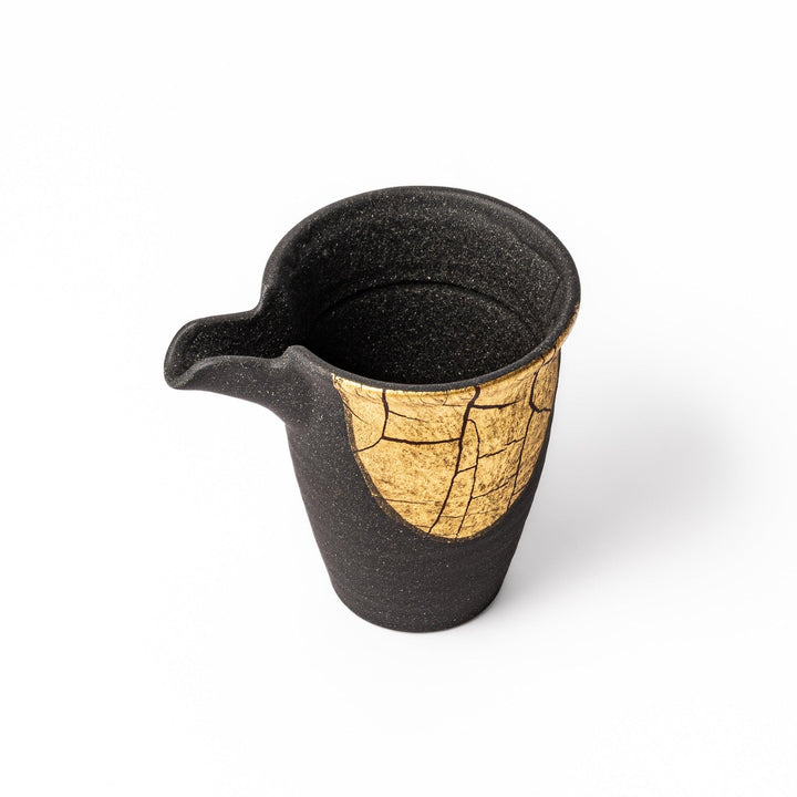 Kintsugi-inspired black Kutani sake carafe with striking gold crackle pattern, showcasing traditional Japanese aesthetics and modern ceramic design.