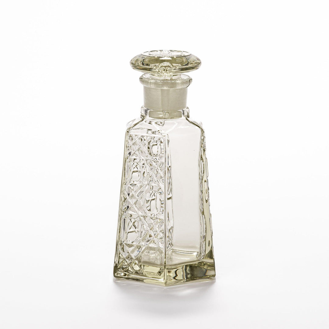 Stylish soy sauce dispenser with a geometric lattice cut design, featuring a smooth pour spout and elegant hexagonal base.
