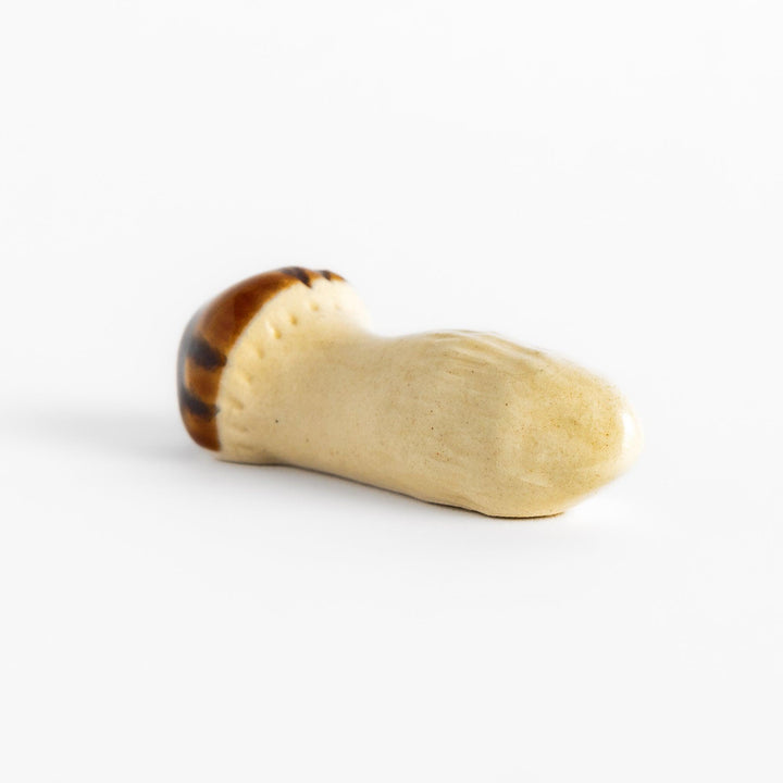 Matsutake Mushroom Chopstick Rest, a charming ceramic rest shaped like a realistic matsutake mushroom, perfect for holding chopsticks while adding a natural touch to the table.