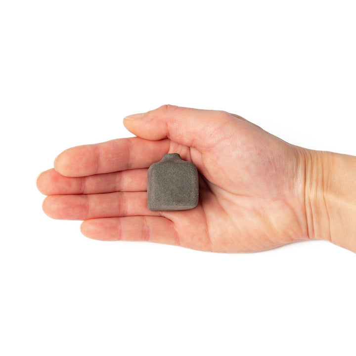 Minimalist dark ceramic bud vase with a square body and soft rounded edges, offering a modern, textured design perfect for small floral accents.